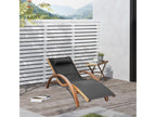 Designer sun lounger in a tropical style, solid natural wood, beige and black color
